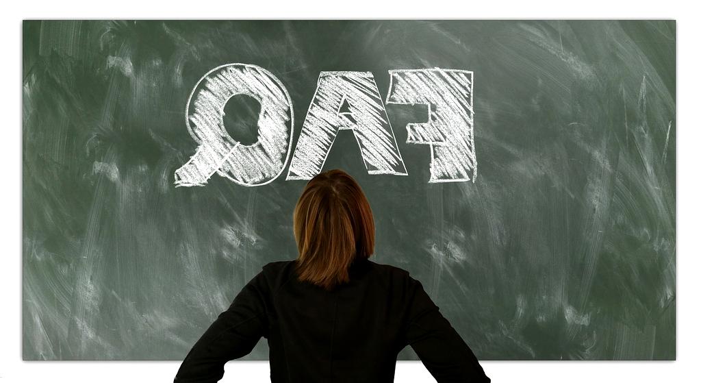 Customer support representative assisting a client via laptop