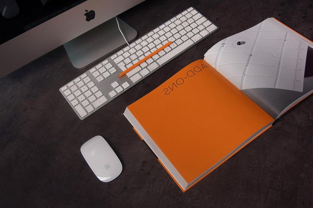 Modern workspace with laptop, books, and digital devices showcasing learning environment